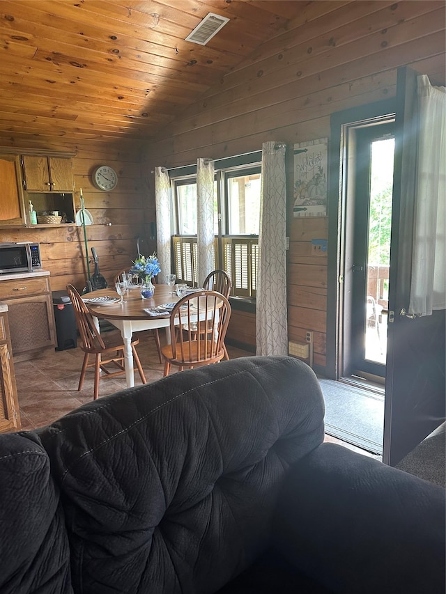 9 Low Rd, Wallkill, NY 12589 - dining space featuring wood walls, vaulted ceiling, and wooden ceiling