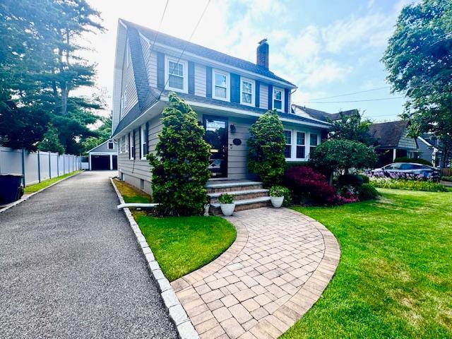 987 E Prospect St, Woodmere, NY 11598 - view of front of property with a chimney