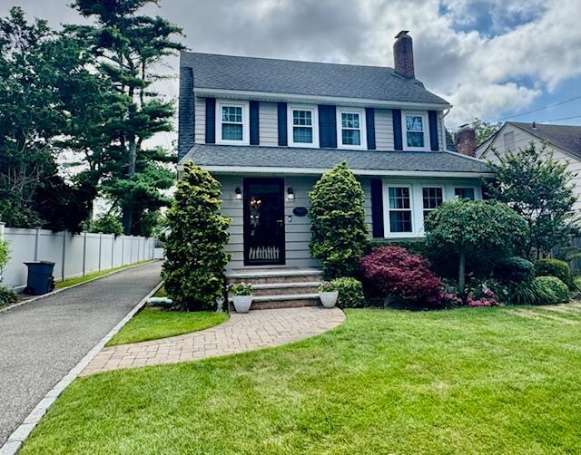 987 E Prospect St, Woodmere, NY 11598 - view of front of house featuring a chimney