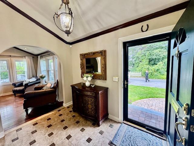 987 E Prospect St, Woodmere, NY 11598 - entrance foyer featuring arched walkways, ornamental molding, and lofted ceiling