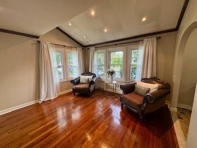 987 E Prospect St, Woodmere, NY 11598 - living area featuring arched walkways, vaulted ceiling, wood finished floors, ornamental molding, and recessed lighting