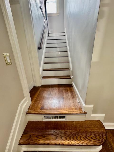 987 E Prospect St, Woodmere, NY 11598 - stairway with wood finished floors