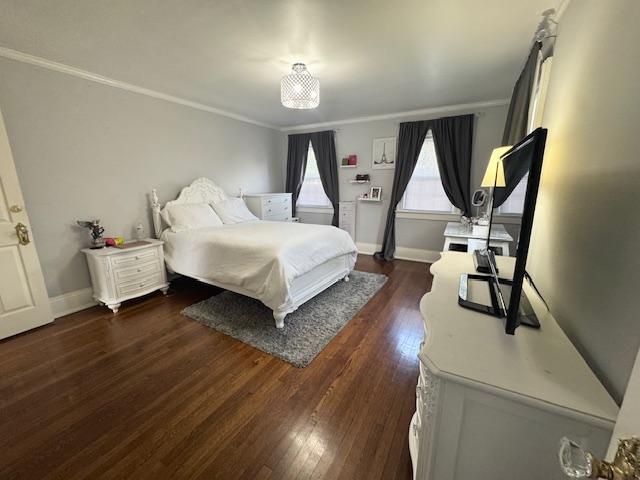987 E Prospect St, Woodmere, NY 11598 - bedroom with ornamental molding and dark wood finished floors