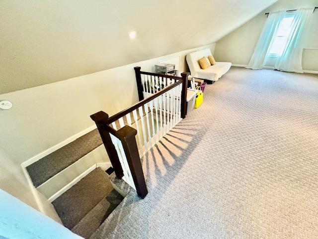 987 E Prospect St, Woodmere, NY 11598 - stairway featuring carpet floors and vaulted ceiling