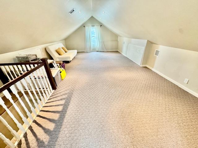 987 E Prospect St, Woodmere, NY 11598 - bonus room with lofted ceiling and carpet flooring