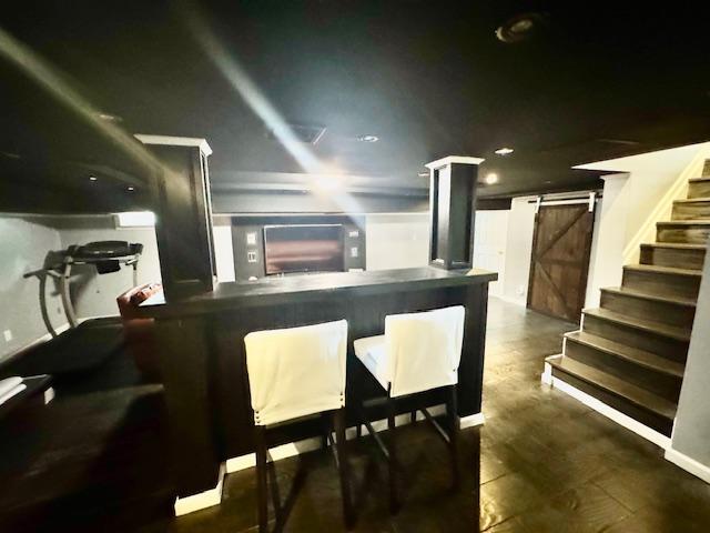 987 E Prospect St, Woodmere, NY 11598 - indoor dry bar with stairway and a barn door