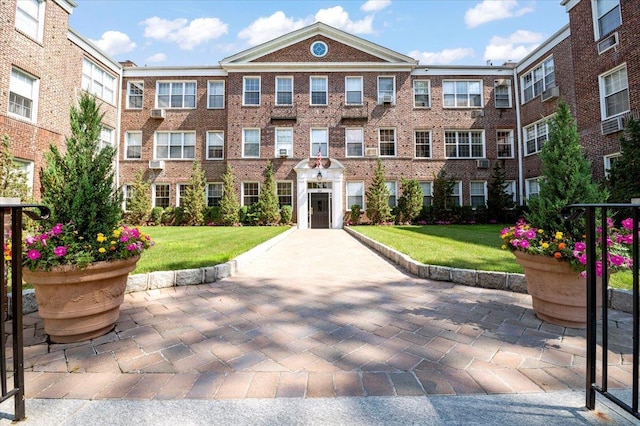 819 Broadway Unit 1G, Woodmere, NY 11598 - view of front of property with a front lawn and brick siding