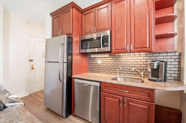 819 Broadway Unit 1G, Woodmere, NY 11598 - kitchen with appliances with stainless steel finishes, open shelves, light wood-style floors, and tasteful backsplash