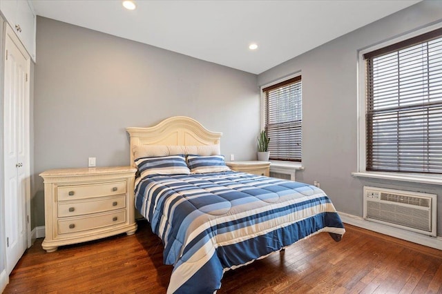 819 Broadway Unit 1G, Woodmere, NY 11598 - bedroom with wood-type flooring, a wall mounted AC, and recessed lighting