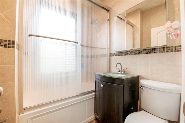 819 Broadway Unit 1G, Woodmere, NY 11598 - full bath featuring tile walls, bath / shower combo with glass door, vanity, and plenty of natural light