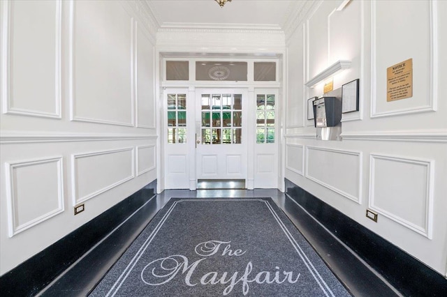 819 Broadway Unit 1G, Woodmere, NY 11598 - entrance foyer featuring a decorative wall, ornamental molding, and a wainscoted wall