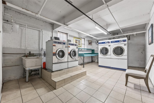 147-25 38th Ave Unit F26, Flushing, NY 11354 - community laundry room featuring washer and dryer and tile patterned floors