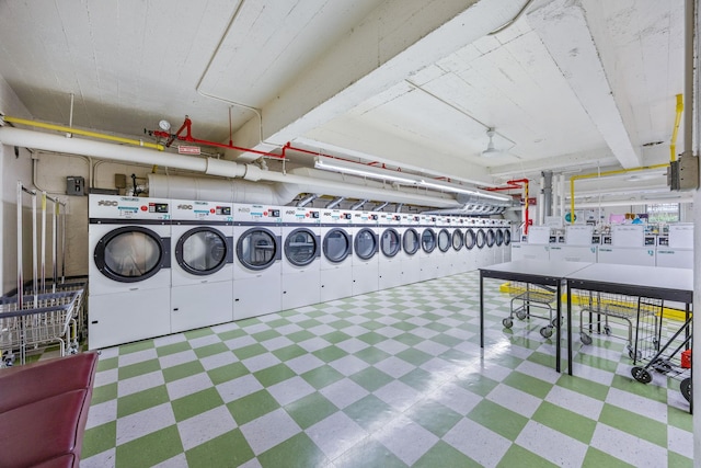142-05 Roosevelt Ave Unit 627, Flushing, NY 11354 - communal laundry room with tile patterned floors and washer and clothes dryer
