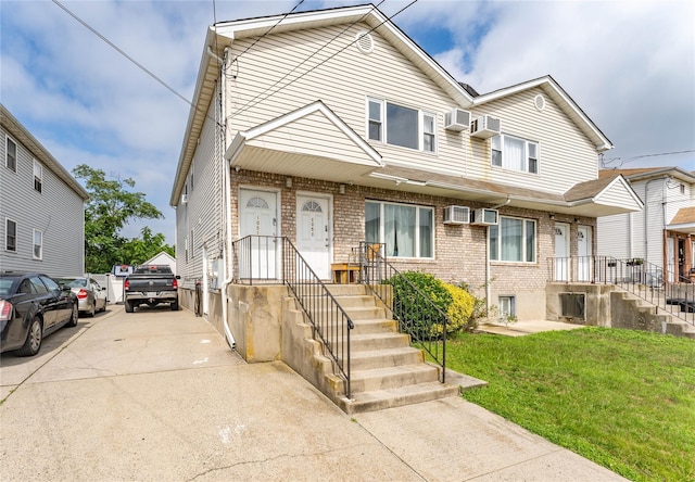 1051 Bay 32nd St, Bayswater, NY 11691 - view of front of home with brick siding, a front lawn, and driveway