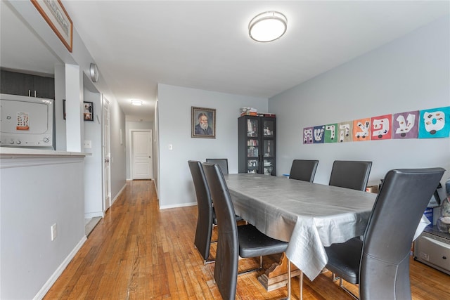 1051 Bay 32nd St, Bayswater, NY 11691 - dining room with light wood-style floors and baseboards
