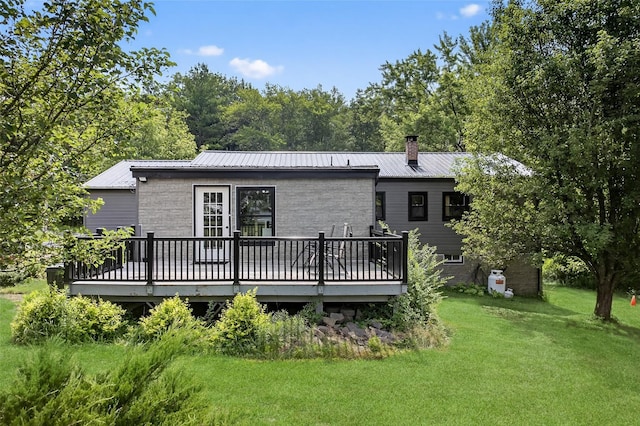 130 Marcus Rd, Ellenville, NY 12428 - back of house with a wooden deck, a lawn, a metal roof, and a chimney
