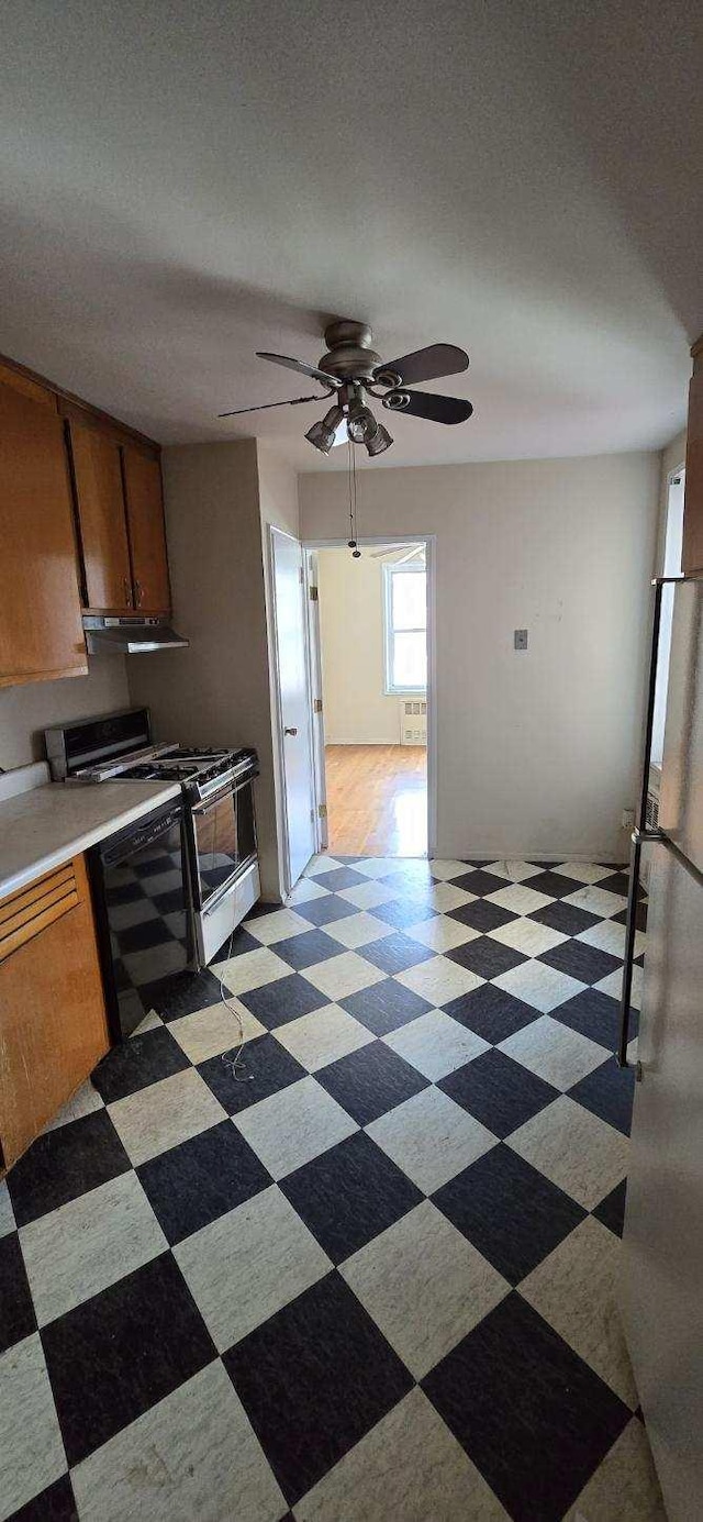 24120 Northern Blvd Unit 4C, Douglaston, NY 11362 - kitchen with light flooring, gas stove, under cabinet range hood, and brown cabinets