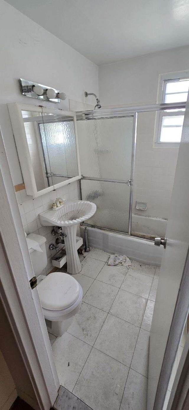 24120 Northern Blvd Unit 4C, Douglaston, NY 11362 - bathroom with a shower with shower door and toilet