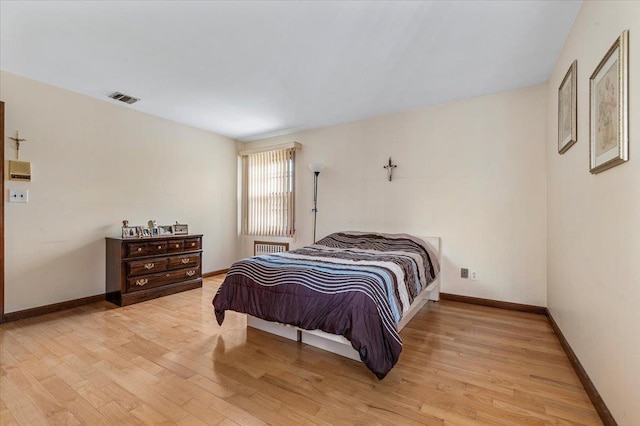227 Randall Ave, Lawrence, NY 11559 - bedroom featuring light wood-type flooring and radiator