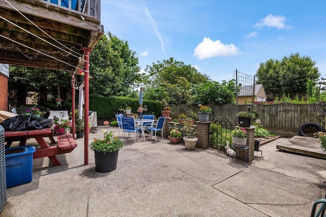 227 Randall Ave, Lawrence, NY 11559 - fenced backyard with outdoor dining space and a patio