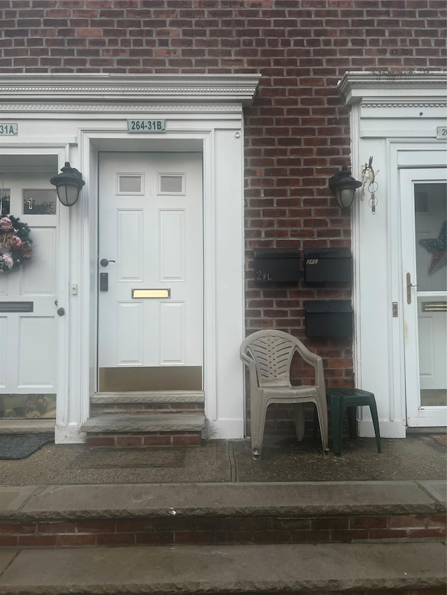 264-31 Langston Ave Fl 2Nd, Glen Oaks, NY 11004 - doorway to property with brick siding