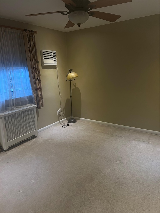 264-31 Langston Ave Fl 2Nd, Glen Oaks, NY 11004 - carpeted empty room with a ceiling fan, a wall mounted AC, and radiator
