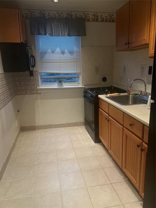 264-31 Langston Ave Fl 2Nd, Glen Oaks, NY 11004 - kitchen featuring black appliances, light tile patterned flooring, light countertops, brown cabinets, and backsplash