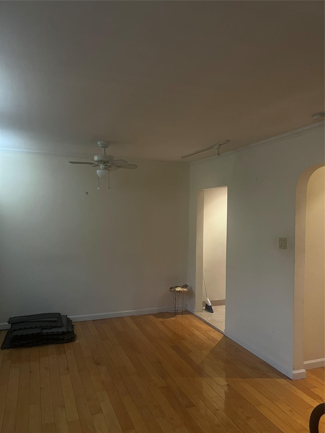 264-31 Langston Ave Fl 2Nd, Glen Oaks, NY 11004 - unfurnished room with arched walkways, ceiling fan, and light wood finished floors