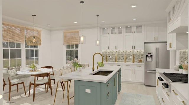 100 Rogers Ave Unit 901, Westhampton Beach, NY 11978 - kitchen featuring appliances with stainless steel finishes, white cabinets, light countertops, custom exhaust hood, and backsplash