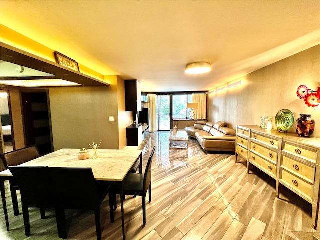 21019 26th Avenue Tl, Bayside, NY 11360 - dining area featuring light wood-style flooring and expansive windows