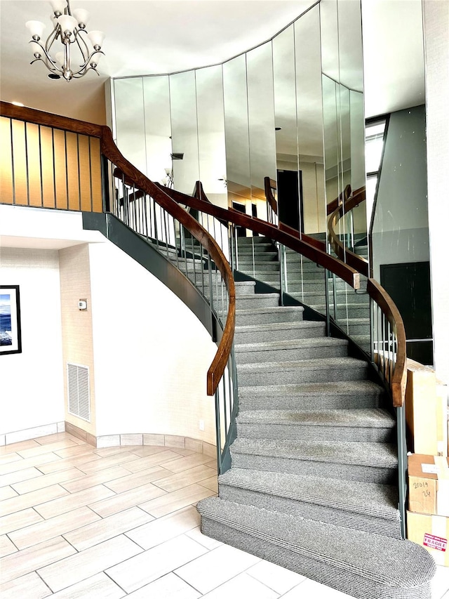 21019 26th Avenue Tl, Bayside, NY 11360 - stairway with a chandelier