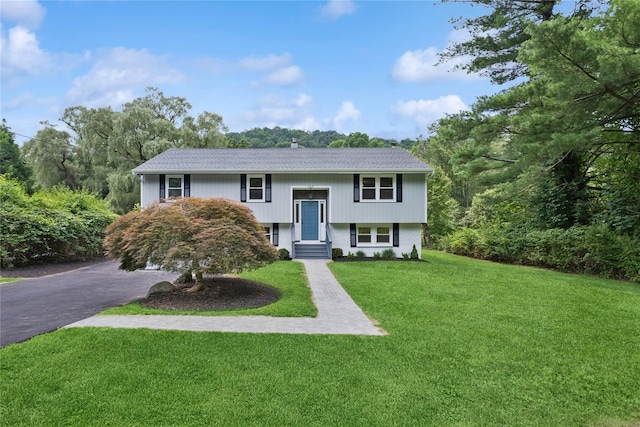297 Farm To Market Rd, Brewster, NY 10509 - split foyer home featuring a front lawn and asphalt driveway