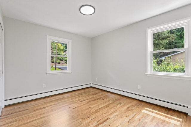 297 Farm To Market Rd, Brewster, NY 10509 - empty room with plenty of natural light, a baseboard radiator, and wood finished floors