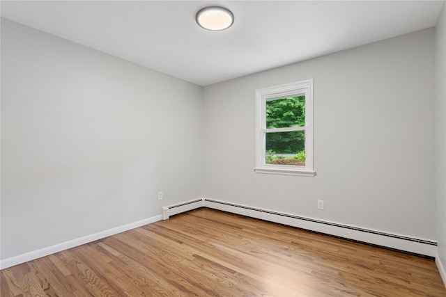 297 Farm To Market Rd, Brewster, NY 10509 - spare room with a baseboard heating unit and wood finished floors