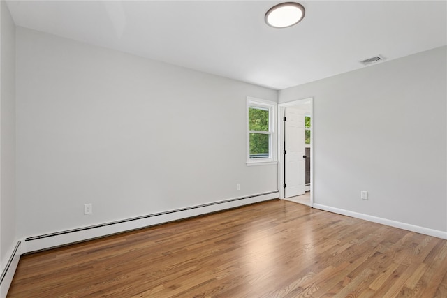 297 Farm To Market Rd, Brewster, NY 10509 - empty room featuring a baseboard radiator and wood finished floors