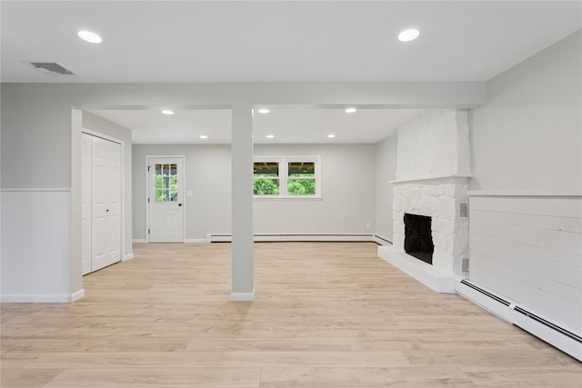 297 Farm To Market Rd, Brewster, NY 10509 - unfurnished living room featuring a baseboard radiator, light wood-type flooring, a fireplace, and recessed lighting