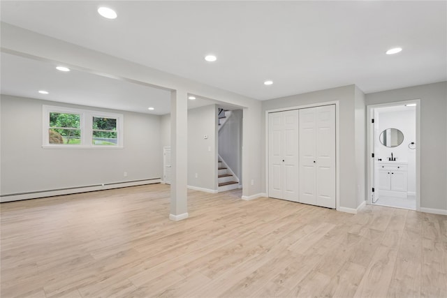 297 Farm To Market Rd, Brewster, NY 10509 - below grade area with a baseboard radiator, stairway, light wood-type flooring, and recessed lighting