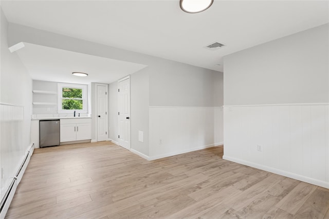 297 Farm To Market Rd, Brewster, NY 10509 - spare room with light wood-style flooring, a baseboard heating unit, and wainscoting