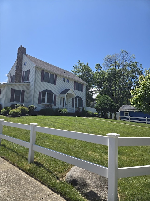 74 Ferris Ln, Poughkeepsie, NY 12601 - view of front of house with a chimney