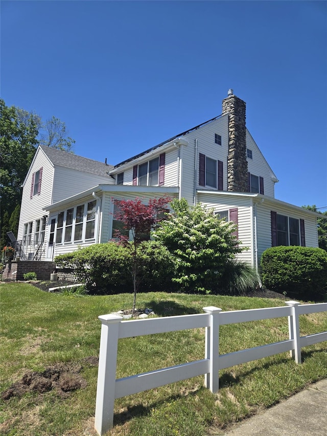 74 Ferris Ln, Poughkeepsie, NY 12601 - view of front facade with a chimney