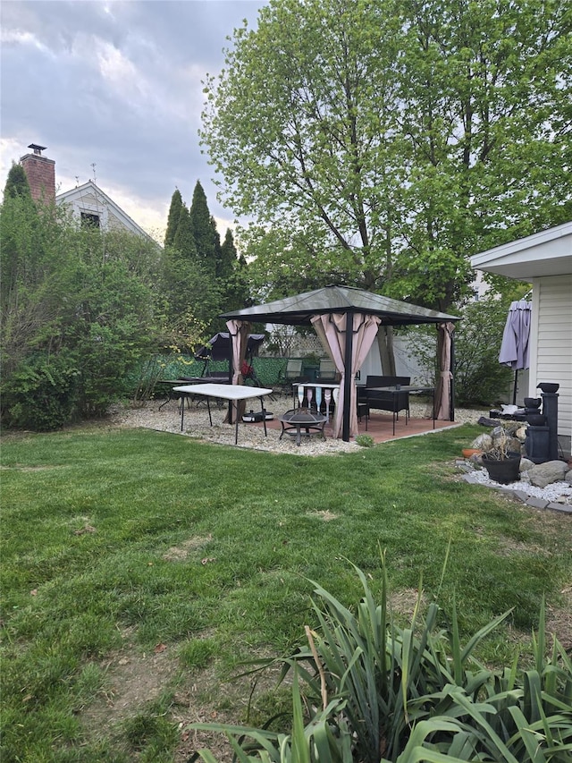 74 Ferris Ln, Poughkeepsie, NY 12601 - view of grassy yard with a gazebo and a fire pit
