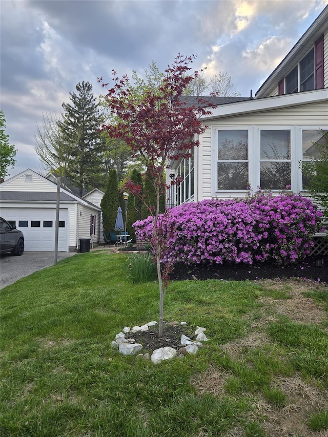 74 Ferris Ln, Poughkeepsie, NY 12601 - view of property exterior with a garage, an outdoor structure, and a yard