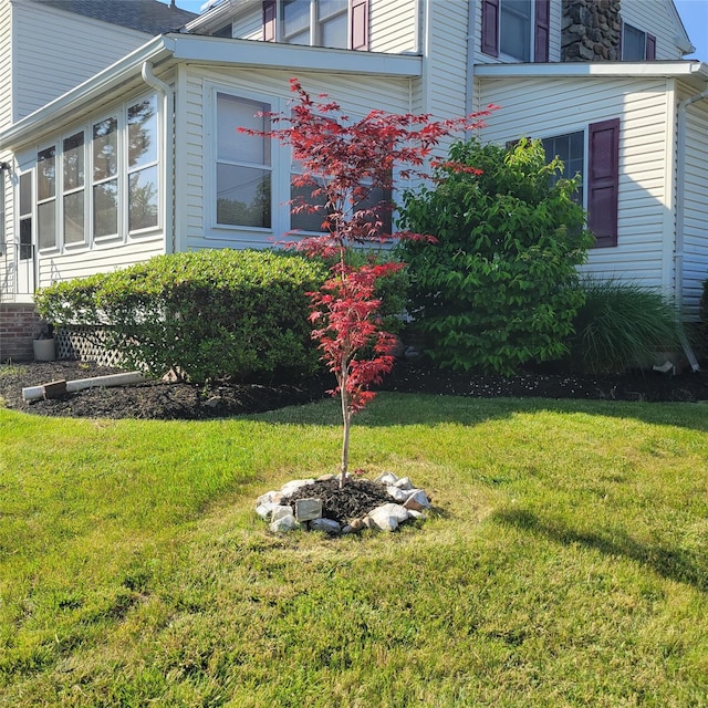 74 Ferris Ln, Poughkeepsie, NY 12601 - view of property exterior featuring a yard and a sunroom