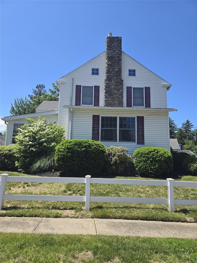 74 Ferris Ln, Poughkeepsie, NY 12601 - view of front of property featuring a chimney