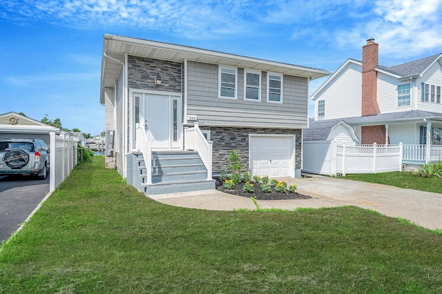 248 E Shore Rd, Lindenhurst, NY 11757 - view of front facade featuring stone siding, driveway, and a garage