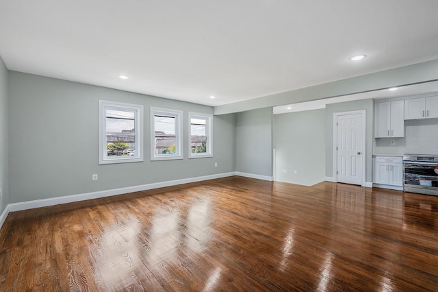 248 E Shore Rd, Lindenhurst, NY 11757 - unfurnished living room with wood finished floors and recessed lighting