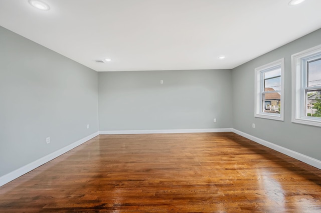 248 E Shore Rd, Lindenhurst, NY 11757 - unfurnished room featuring recessed lighting and wood finished floors