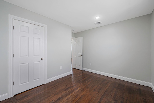 248 E Shore Rd, Lindenhurst, NY 11757 - unfurnished bedroom with dark wood-style floors and recessed lighting