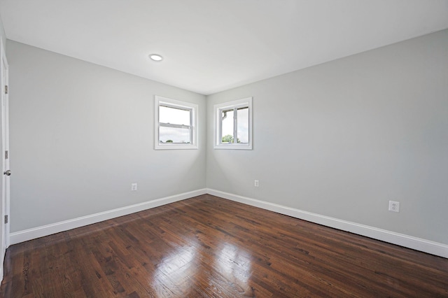 248 E Shore Rd, Lindenhurst, NY 11757 - unfurnished room featuring dark wood-type flooring and recessed lighting