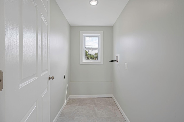 248 E Shore Rd, Lindenhurst, NY 11757 - laundry room featuring baseboards and hookup for a washing machine